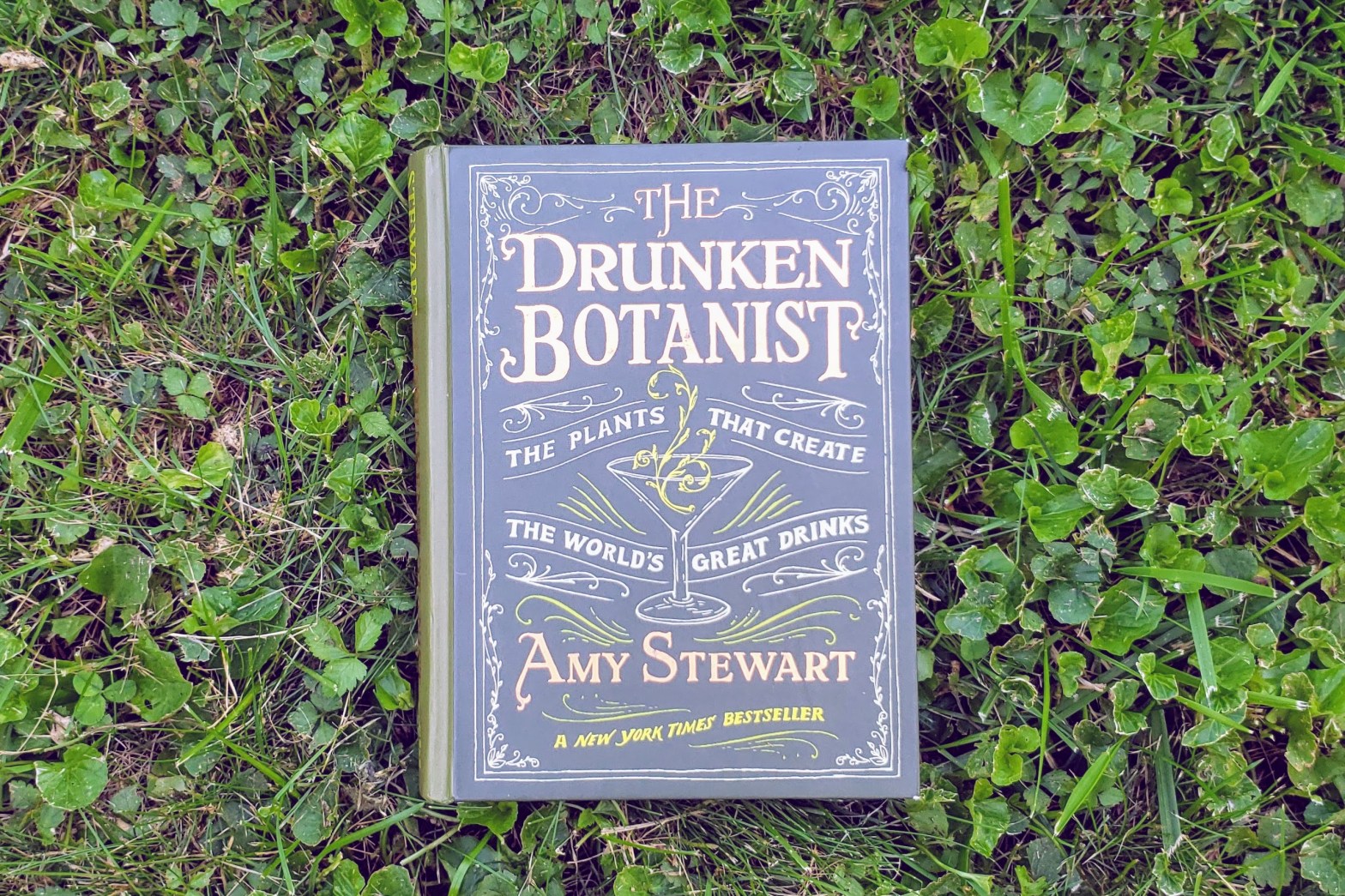 The Drunken Botanist by Amy Stewart book in grass
